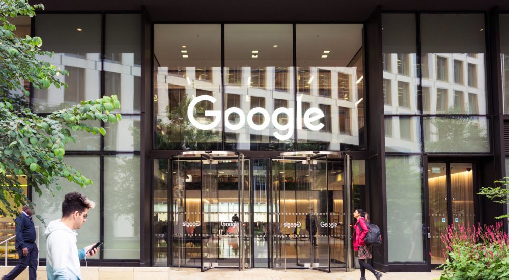 London, UK - People outside Google's headquarters office building in King's Cross, London.