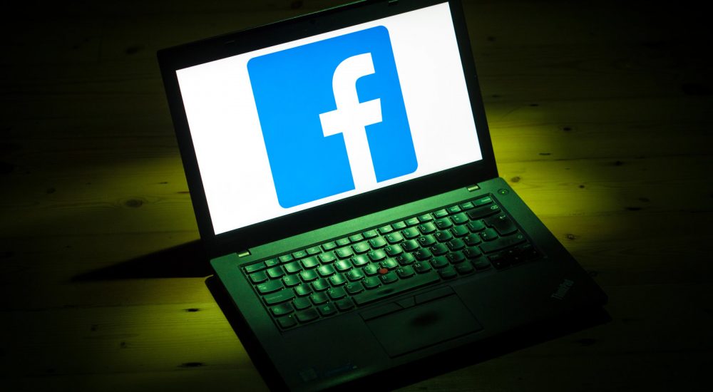 The logo of social networking site Facebook is displayed on a laptop. (Photo by Dominic Lipinski/PA Images via Getty Images)