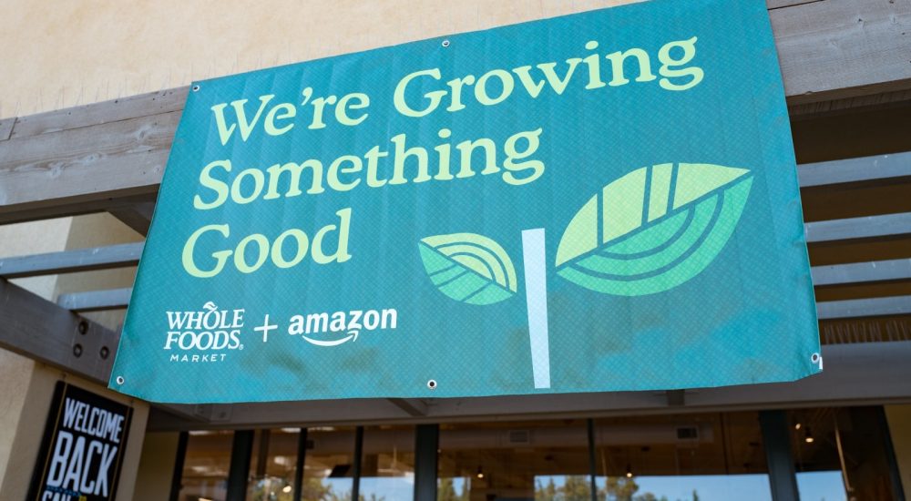 Signage on the Whole Foods Market store in San Ramon, California reading "We're growing something good", announcing the acquisition of Whole Foods Market by online retailer Amazon, August 28, 2017. On August 28, 2017, Amazon completed its acquisition of the upscale grocery chain. (Photo via Smith Collection/Gado/Getty Images).