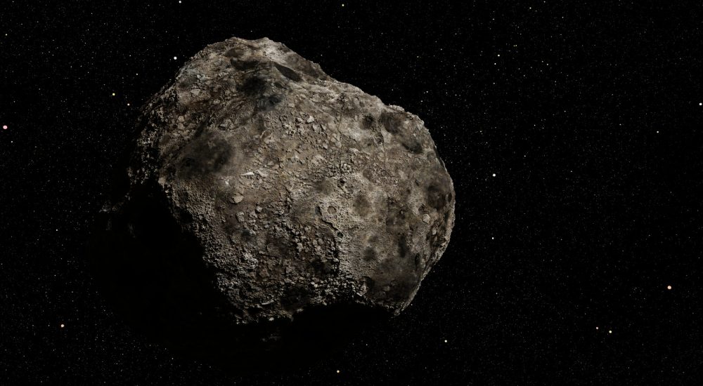asteroid in deep space lit by the stars