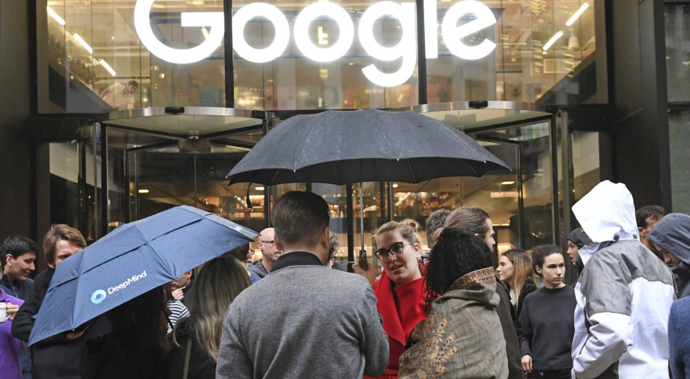 People outside the Google offices in Granary Sqaure, London, Thursday Nov. 1, 2018. Hundreds of Google engineers and other workers walked off the job Thursday morning to protest the internet company’s lenient treatment of executives accused of sexual misconduct. Employees were seen staging walkouts at offices in Tokyo, Singapore, London, and Dublin. (Stefan Rousseau/PA via AP)