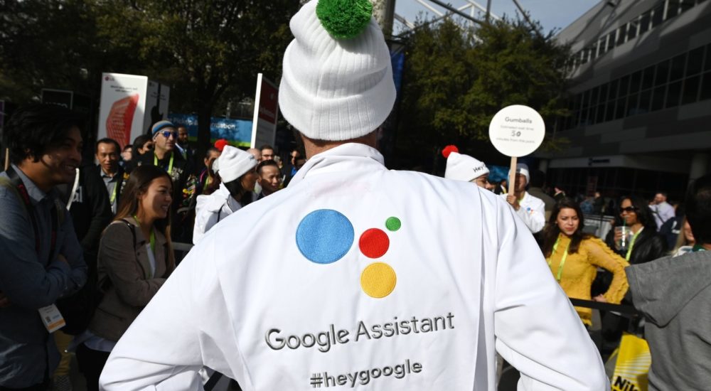Attendees wait to ask a question of a Google Assistant at a giant "Hey Google" gumball machine game at CES 2019, January 8, 2019 at the Las Vegas Convention Center in Las Vegas, Nevada. - Google Assistant is an artificial intelligence-powered virtual assistant which can engage in two-way conversations. (Photo by Robyn Beck / AFP)        (Photo credit should read ROBYN BECK/AFP/Getty Images)