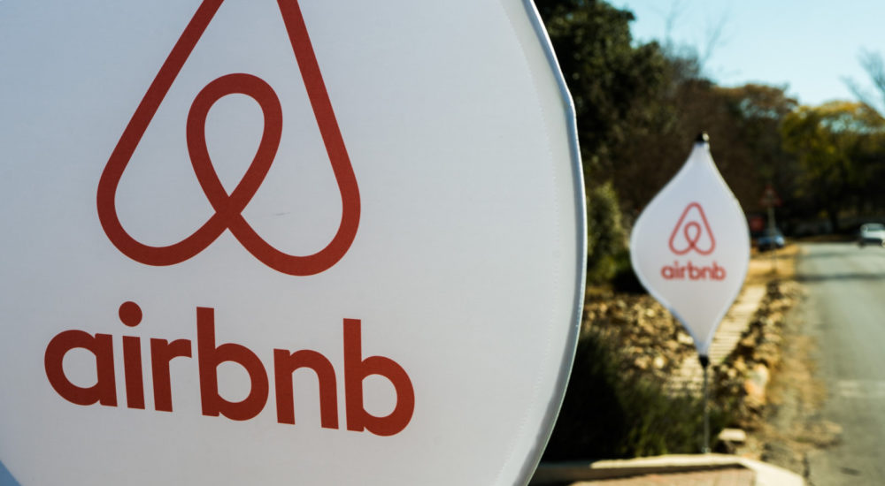 The logos of Airbnb Inc. sit on banners displayed outside a media event in Johannesburg, South Africa, on Monday, July 27, 2015. Airbnb is hoping to spread its unique brand of hospitality throughout Africa. Photographer: Waldo Swiegers/Bloomberg via Getty Images