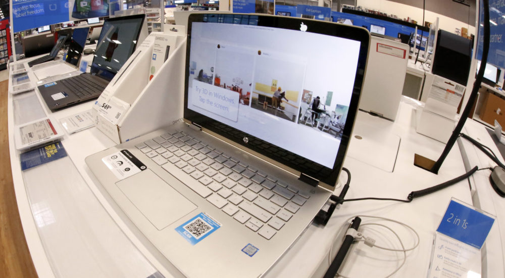 This Thursday, Feb. 22, 2018 photo shows a display of Hewlett-Packard laptop computers in a Best Buy store in Pittsburgh. (AP Photo/Gene J. Puskar)