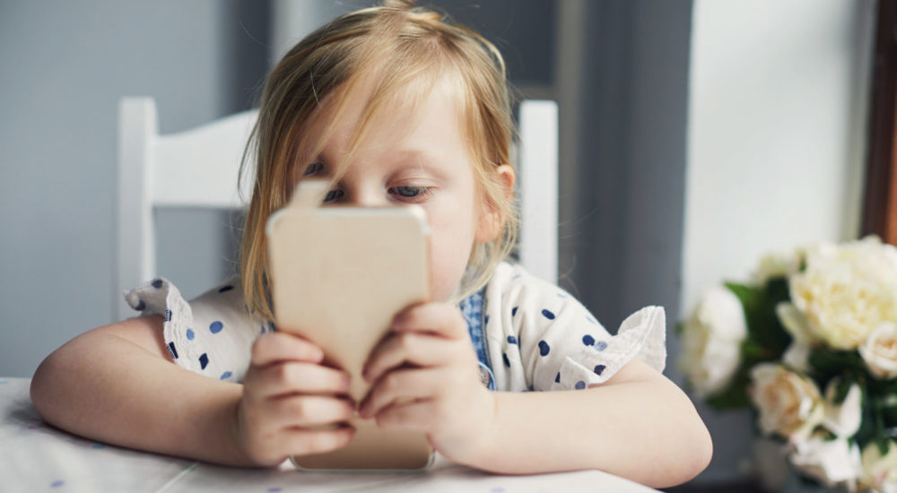 Toddler girl using a smartphone