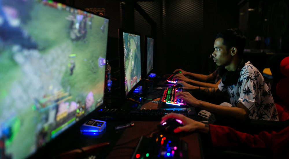 This photo taken on August 22, 2019 shows eSports professional player Myint Myat Zaw, also known as "Insane", playing Dota 2 at an eSports shop in Yangon. - Myanmar's gaming scene is mushrooming, but frequent power cuts are holding players back in the emerging democracy. (Photo by Sai Aung MAIN / AFP) / TO GO WITH Myanmar-eSports-youth, FEATURE by Lapyae KO and Dene-Hern CHEN        (Photo credit should read SAI AUNG MAIN/AFP via Getty Images)