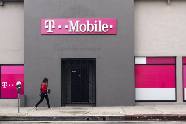 LOS ANGELES, CA, UNITED STATES - 2019/02/14: A pedestrian seen walking past a T-Mobile store in Los Angeles. (Photo by Ronen Tivony/SOPA Images/LightRocket via Getty Images)